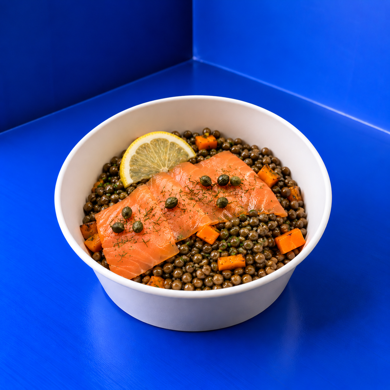 Fresh lentil and salmon salad with carrots, celery, capers and chives, handcrafted by Juliette Boulangerie in Zurich.