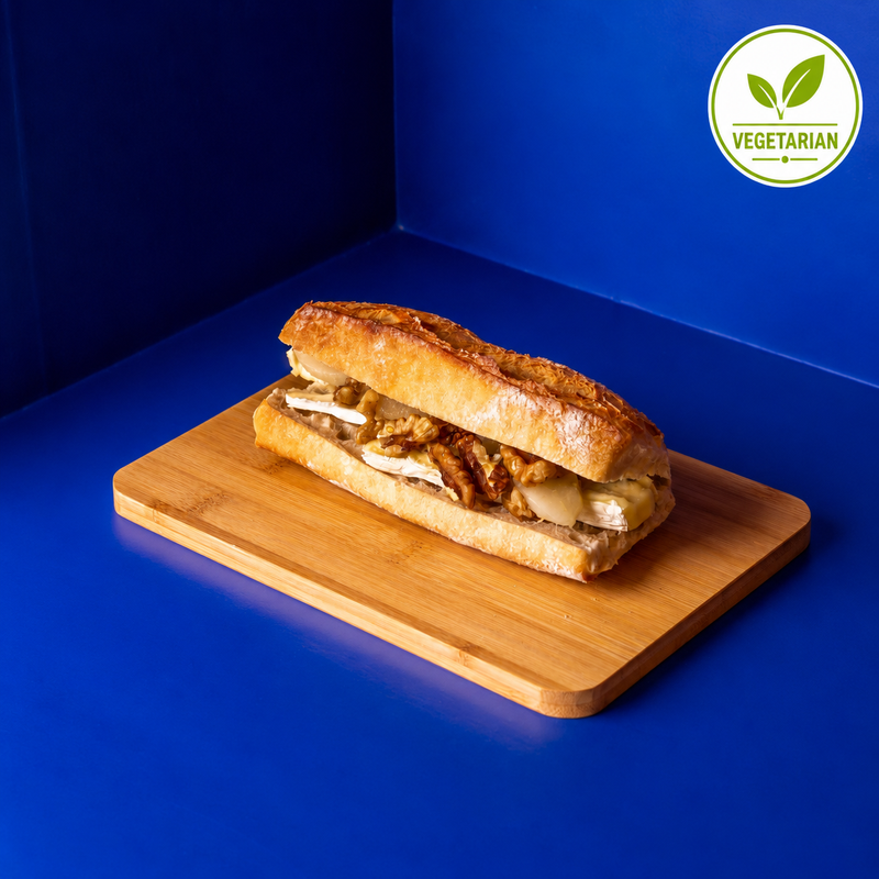 Vegetarian Brie-cheese sandiwich with walnuts, hoeny and pears in a homemade french baguette bread